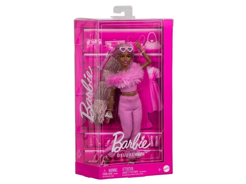 Barbie-nukke punotuilla pinkeillä hiuksilla ja turkisasulla